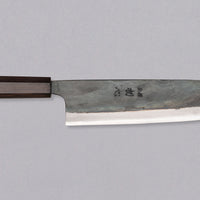 Kokugei Gyuto Aogami #1 Kuro-uchi Ebony 240 mm prikazan z desne strani, s poudarjenim Aogami #1 jeklom in robustnim ročajem iz ebenovine.