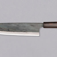 Kokugei Gyuto Aogami #1 Kuro-uchi Ebony 240 mm prikazan z leve strani, z vidnim kuro-uchi zaključkom in elegantnim ročajem iz ebenovine.