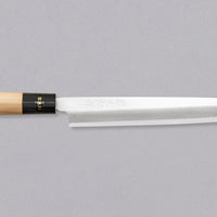 Nož Yanagiba 240 mm priznanega proizvajalca Tojiro, ki ga zaznamuje japonski magnolijin ročaj z obročkom roga vodnega bivola, minimalistično oblikovano rezilo in vrhunsko Shirogami #1 jeklo. Rezultat je lahek, oster, vsestranski kuhinjski nož za domače in poklicne kuharje z rezilom, ki dolgo drži ostrino in se enostavno ponovno nabrusi.