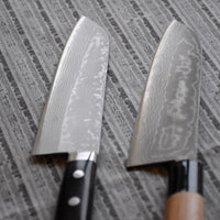 Masutani Santoku Damascus Black 170 mm_3 Masutani Santoku Damascus Black je japonski nož za zelenjavo, meso in ribe z damask vzorcem in yo pakka ročajem. Nož je izjemno tanek (1,8 mm), zato bo z lahkoto zdrsel skozi hrano, izbira jekla pa mu zagotavlja trpežnost in odpornost proti obrabi. Primeren je za nakup prvega japonskega kuhinjskega noža ali darilo.