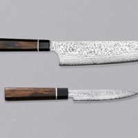 Black Damascus linija je naša linija nožev s 33-slojnim damask vzorcem, zaradi katerega je vsak kos unikaten. Senzo Black Damascus se kuje v kovačiji Suncraft. Ta set je sestavljen iz japonskih kuhinjskih nožev Bunka Black Damascus 200 mm in Black Damascus Utility 120 mm, izdelana iz odličnega nerjavečega VG-10 jekla.